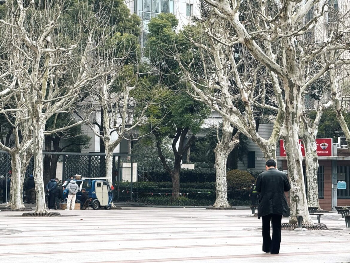 A man walking at the Huai Hai Park in Huangpu, Shanghai.