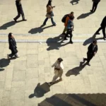 Pedestrians at Peace Hotel, Shanghai.