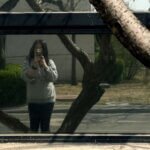 A reflection photograph taken in Beijing, blending the real scene with its mirrored counterpart to create a layered image where reality and reflection coexist.